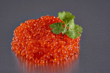 Salmon roe on metal