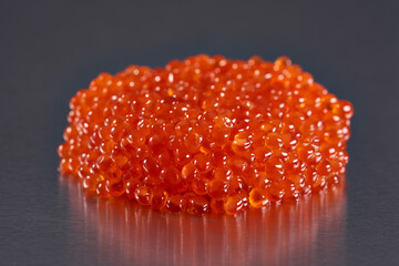 Salmon roe on metal