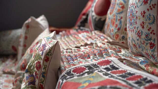 Shop of traditional embroidery of Uzbekistan, bright ornaments in the national style, history and relics. Shop of national clothing and embroidery. National pattern of Uzbekistan