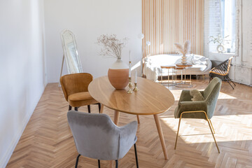 expensive modern light luxury interior design of a spacious living room with wooden elements and white walls. filled with original and unusual decorative things