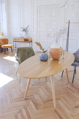 expensive modern light luxury interior design of a spacious living room with wooden elements and white walls. filled with original and unusual decorative things