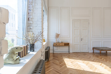 expensive modern light luxury interior design of a spacious living room with wooden elements and white walls. filled with original and unusual decorative things