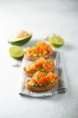 Homemade salmon bruschetta with avocado