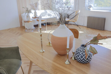 expensive modern light luxury interior design of a spacious living room with wooden elements and white walls. filled with original and unusual decorative things