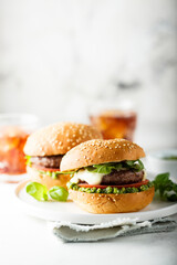 Traditional homemade beef burgers with pesto sauce