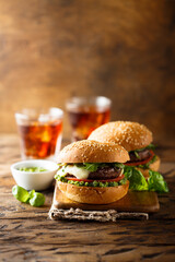 Traditional homemade beef burgers with pesto sauce