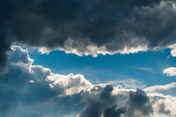Naklejka na ściany i meble blue sky with dramatic cloudscape fly trough