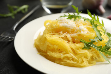 Tasty spaghetti squash with cheese and arugula