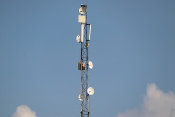 Mathura, Uttar Pradesh India- August 25 2021: A tall mobile towers with clear background sky. Telecom service provider for the advanced 5g internet connection.