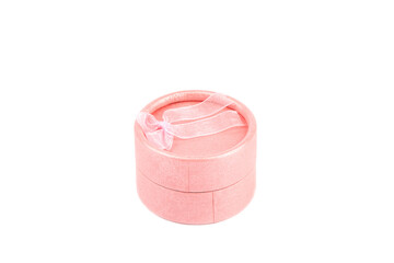 Round pink gift box isolated on white background.