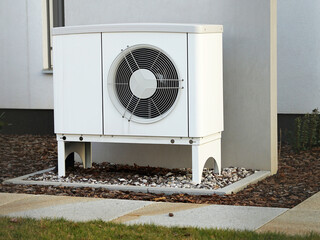 Heat pump reduce living cost in modern house of future, green renewable energy concept of heat pump
