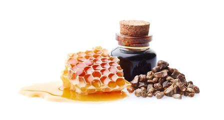 Honeycomb with propolis tincture on white background