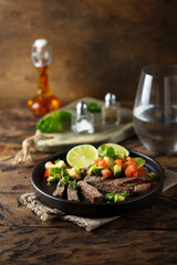 Grilled beef steak with avocado salsa