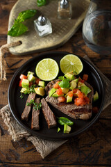 Grilled beef steak with avocado salsa