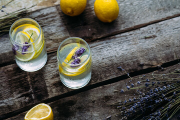 Lemonade with lemon, lavender and ice in a glass