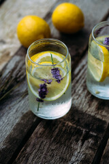 Lemonade with lemon, lavender and ice in a glass