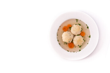 Traditional Jewish matzah ball soup isolated on white background. Top view. Copy space
