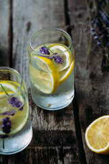 Lemonade with lemon, lavender and ice in a glass