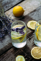 Lemonade with lemon, lavender and ice in a glass
