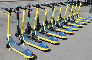 Electric scooters parked in a sharing station point