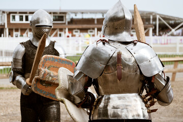 Two medieval knights in heavy armor are ready for battle. Modern reconstruction of ancient...