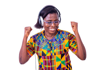 adult woman listening to music with her headphones and making the winning gesture.