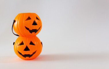 Candy baskets in the shape of halloween lantern pumpkin on white background. Selective focus. Copy space.