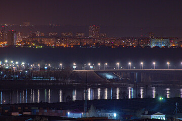 Fototapeta premium the bridge glows with lights in the night 