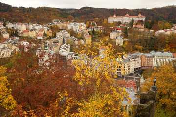 Karlovy Vary famous chamois statue, symbol of spa town in autumn atmosphere with yellow coloured...