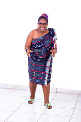 portrait of a beautiful African woman in traditional dress dancing, happy.