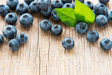 Blueberries on vintage wooden brown background