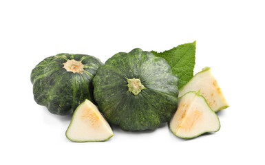 Whole and cut green pattypan squashes with leaf on white background