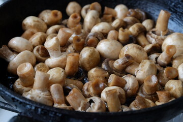 texture of mushrooms fried in sunflower oil close up