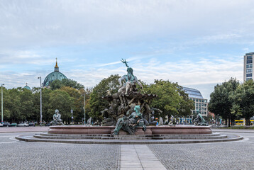 Fototapeta na wymiar Berlin, Germany. Fountain Neptune with bronze sculptures, 1891