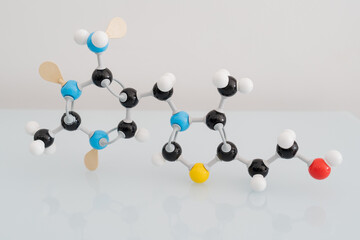 Isolated vitamin B1 made by molecular model with reflection on white background. Thiamine chemical...