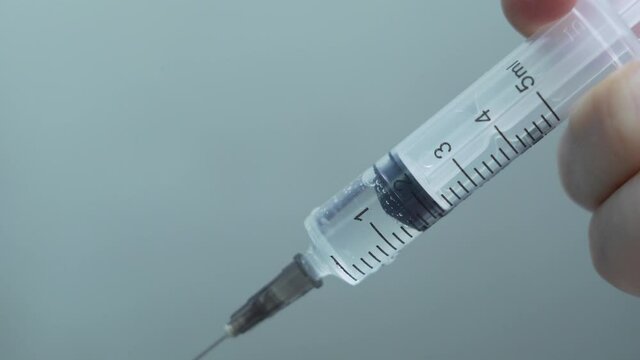 Syringe with Injection, Close-Up, Isolated. Vaccination, Medicine, Needle, Vaccine, Bottle, Dose, Subcutaneous Injection. Treatment and Prevention of Diseases.