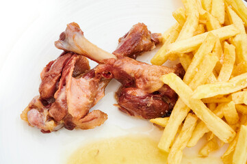 Fried chicken thighs with french fries