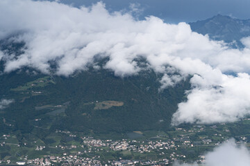 clouds rolling over the mountains of meran