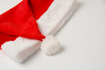 Obraz na płótnie Canvas Santa hat on white background, isolate close up with copy space