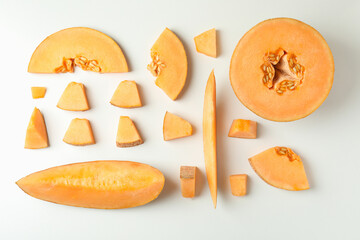 Flat lay with melon slices on white background