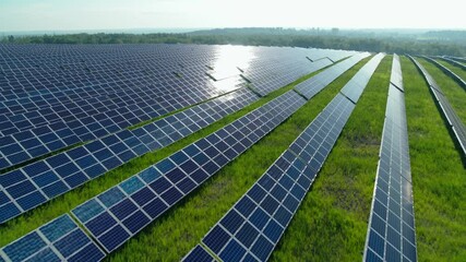 Top view of solar farm with hundreds panels on field