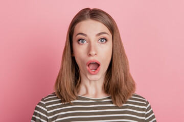 Portrait of shocked lady open mouth wow reaction look camera on pink background