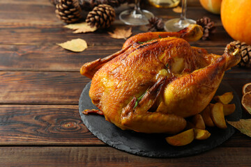 Thanksgiving Day roast turkey on wooden table