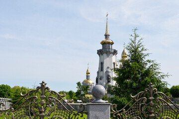 Christian church cross in high steeple tower for prayer