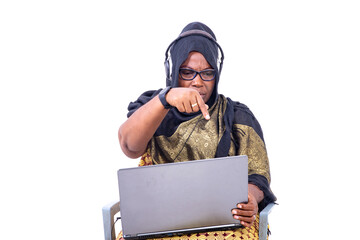 portrait of a beautiful muslim businesswoman with laptop and headset, unhappy.