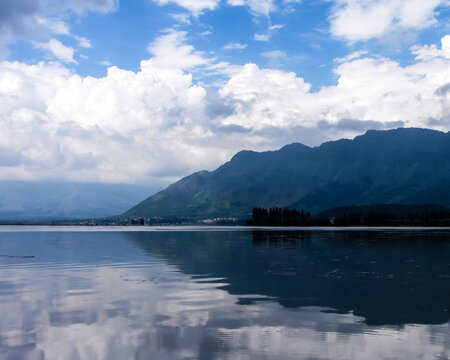 Reflections of  Zabarwan Hills and clouds on Dal Lake,Kashmir,India 