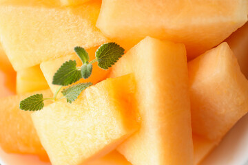 Fresh ripe melon pieces, close up and selective focus