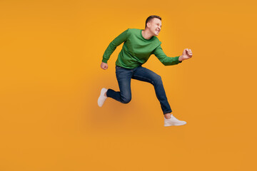 Fototapeta na wymiar Profile portrait of funky positive guy jump run late date on yellow background