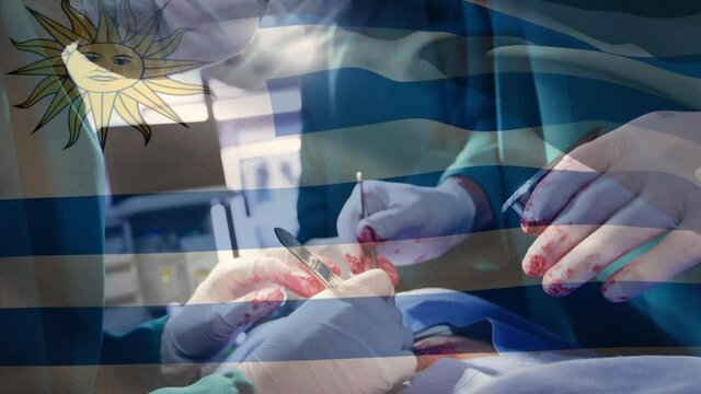 Animation of flag of uruguai waving over surgeons in operating theatre