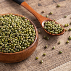Close up of raw mung bean on wooden table background.